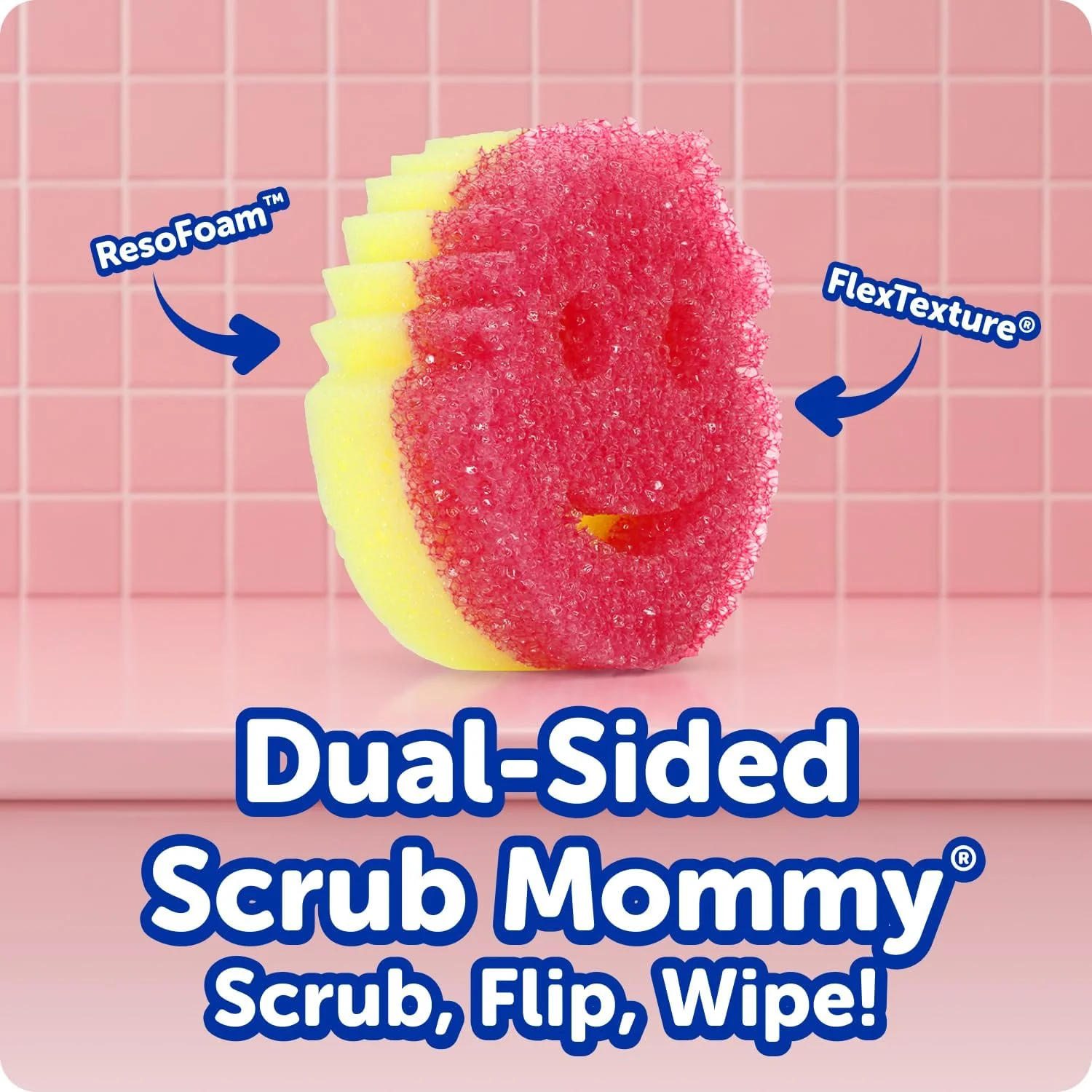 A pink and yellow dual-sided smiley face sponge standing on a pink surface, highlighting the ResoFoam and FlexTexture sides.
